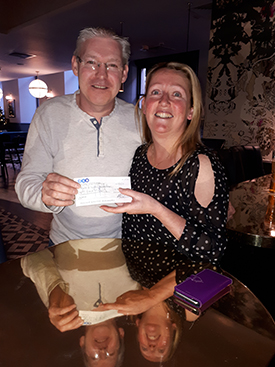 DJ (Derek Johnston) hands over a cheque for £5,400 to Carolyn Thornton, the Scottish Fundraising Manager for the event's main charity beneficiary, Make-A -Wish UK. 