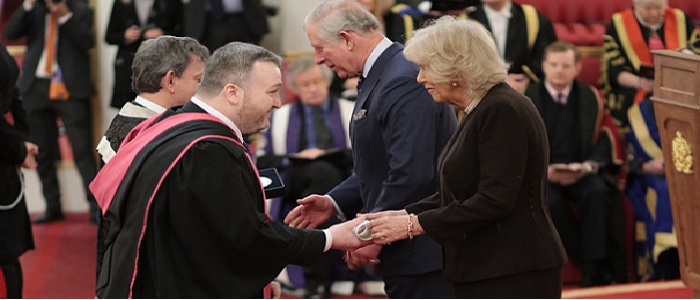 Professor Marc Alexander and Professor Sir Anton Muscatelli receives UofG Queen's Anniversary Prize from the Prince of Wales and Duchess of Cornwall