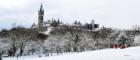 Image of the University in the snow from Kelvingrove Park