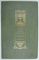 photograph of a green hard back book cover decorated with gold leaf.  The Decoration is the title and author written out in Art Deco style writing and includes an image depicting the brow of a ship approaching through water with its sail raised.  The sail has an eye motif as decoration.