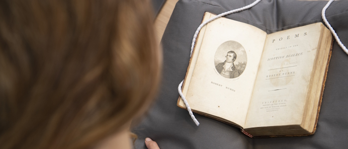 Student viewing a special collections book