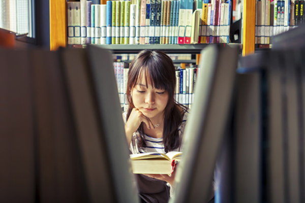 A woman studying in the library