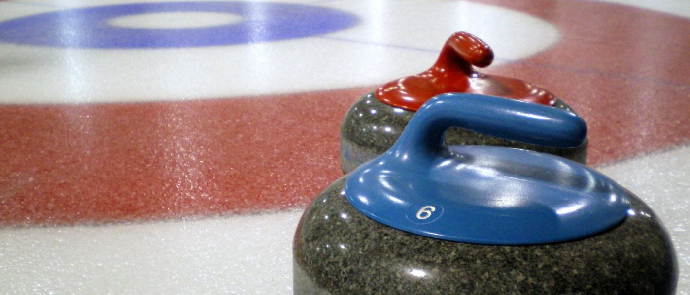 Curling stones on an ice rink