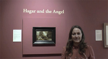 Birthe Jorgensen stands in front of the John Runciman painting, 