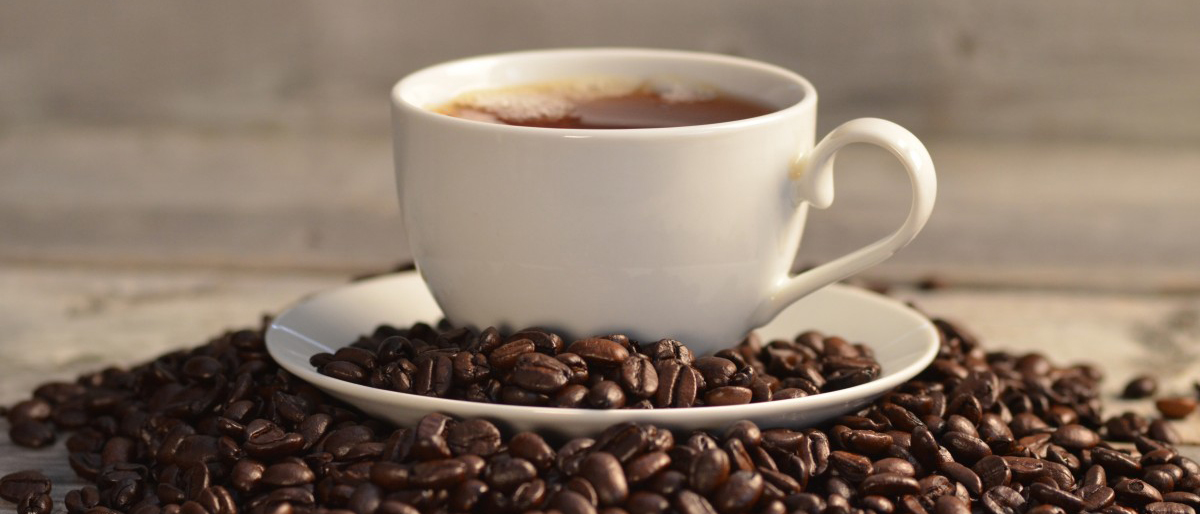Photo of coffee cup and coffee beans