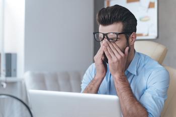 Photo of stressed male researcher