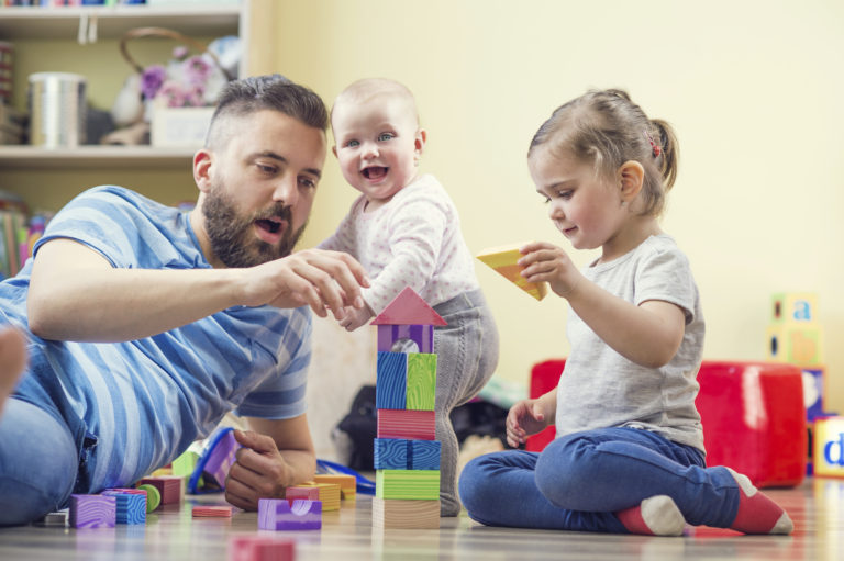 photograph of father playing with children, 768x511px