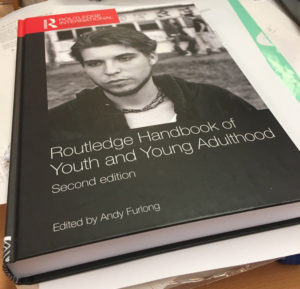 Photo of the cover of Routledge Handbook of Youth and Young Adulthood, Second Edition, 300x289px