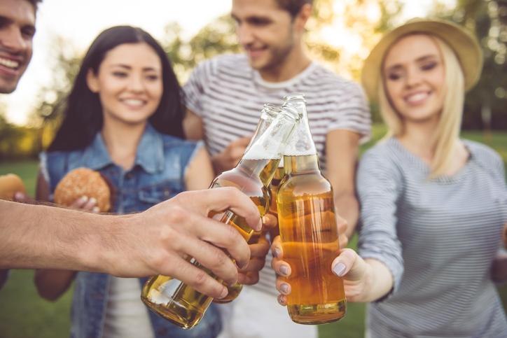 Group of young people drinking outdoors, 720x483px