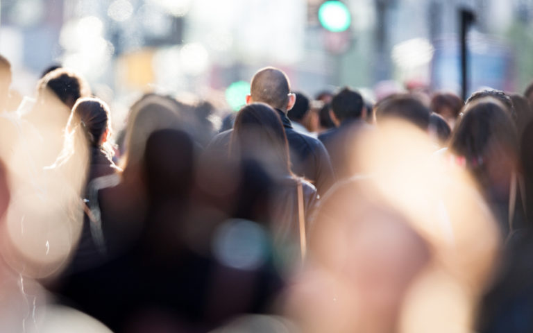 Photo of people in street taken from behind, 768x480px