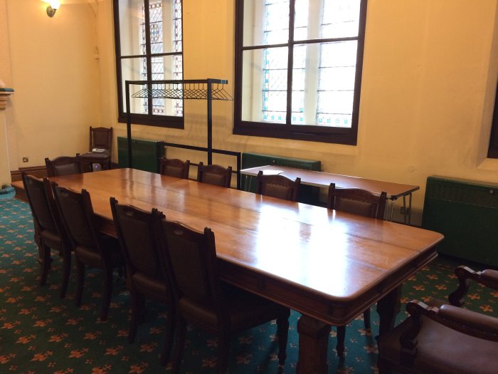 Flat floored meeting room with boardroom table and chairs