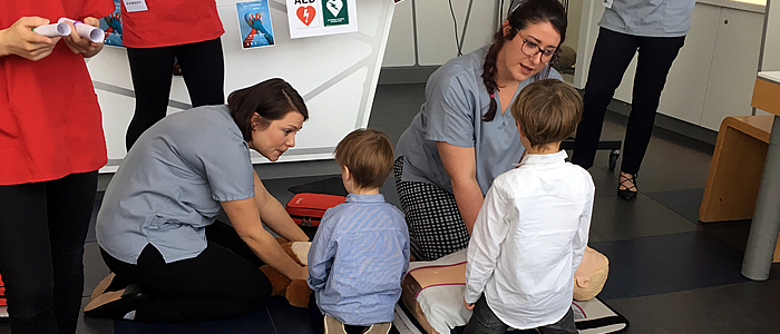 Children learning on dummies