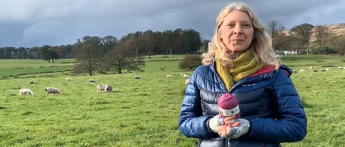 A photo of Professor Lynn Abrams at the launch of Cochno wool at the University of Glasgow's Cochno Farm where our sheep are housed.