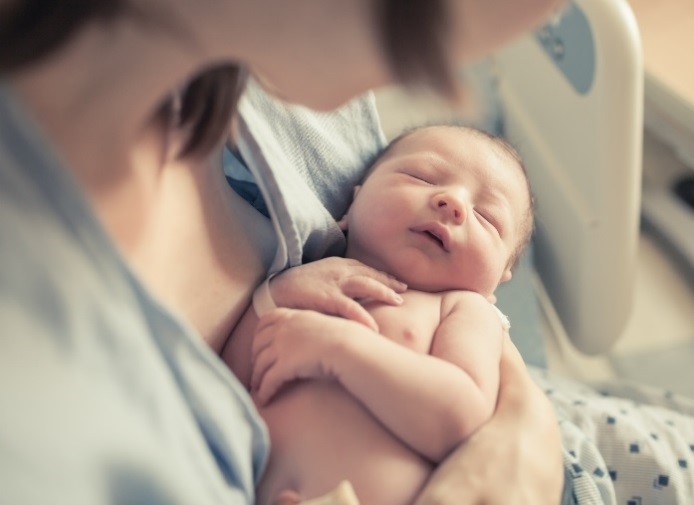 A newborn baby with mum