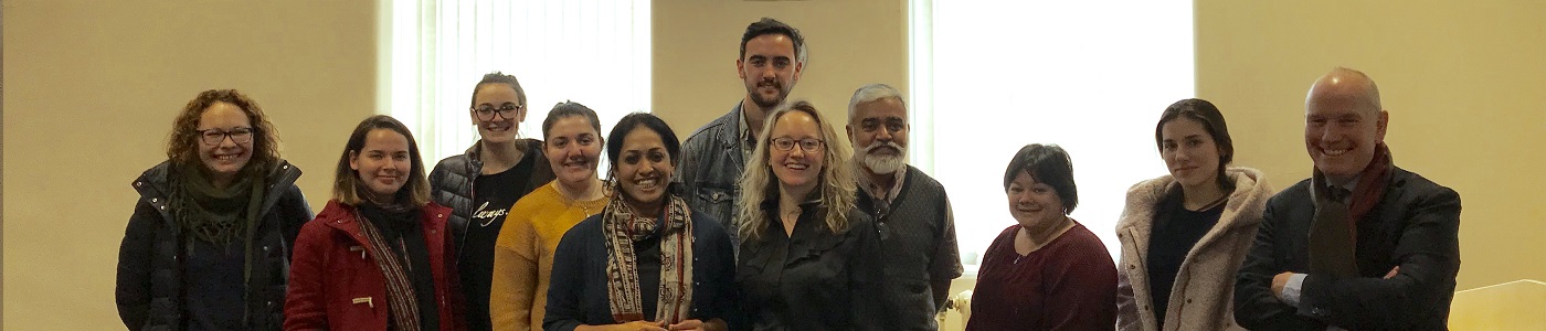 group of people standing together and smiling