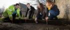 Nicola Reid, Field Archaeolgist, Northlight Heritage; Mark McGettigan, aged 14; Megan Kasten, Project Office & Volunteer, Northlight Heritage and Ingrid Shearer, Community Engagement Officer for Stones & Bones excavation, Northlight Heritage examining one of the three Govan Stones rediscovered at Govan Old Parish Church. 700 x 300 