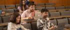 A group of students sitting in a lecture theatre