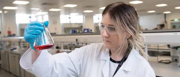 a female chemistry student in a lab