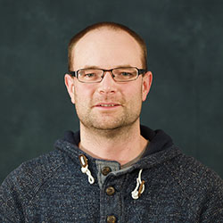 A portrait photograph of Dr Kevin Worrall