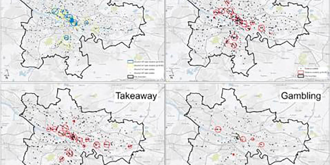 A photo of four maps of Glasgow pointing out environmental bads