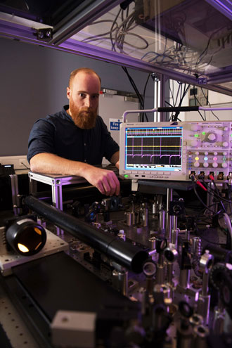 Dr. Mario González Jiménez working with the femtosecond amplified laser system