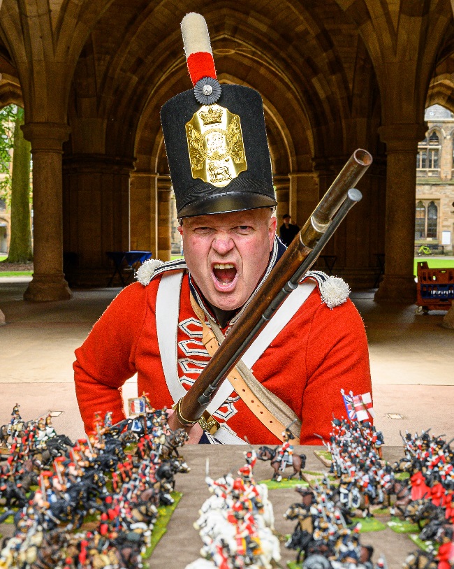 Napoleonic re-enactor Rob Woods of the First Regiment of Foot, Royal Scots with sone of the 20,000 28mm miniature soldiers being used to replay the Battle of Waterloo at the University of Glasgow this week end Saturday 15 and Sunday 16 June 2019. It will be the biggest ever historical table top war game. Credit: John Young / YoungMedia.co.uk 