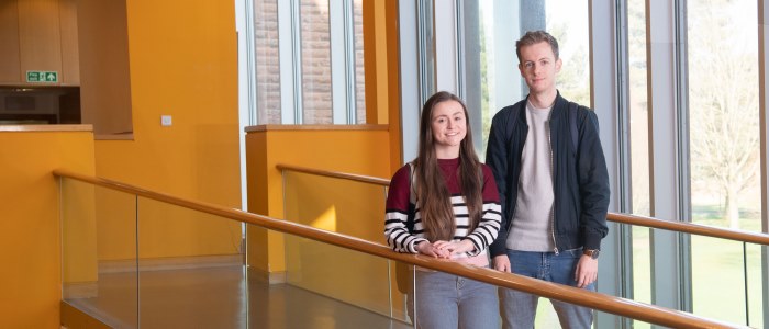 female and male student on bridge in Rutherford McCowan building