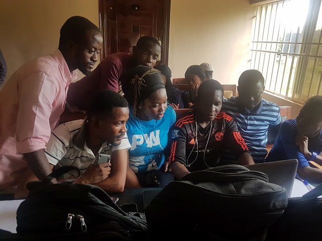 A photo of University of Glasgow's Sofiat Olaosebikan with African scientists