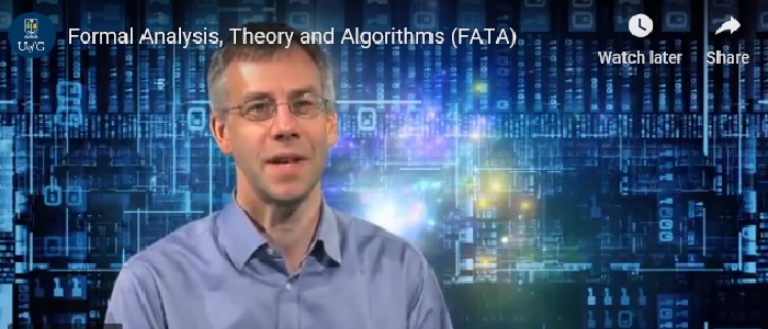 Professor Simon Gay in front of an abstract computer image
