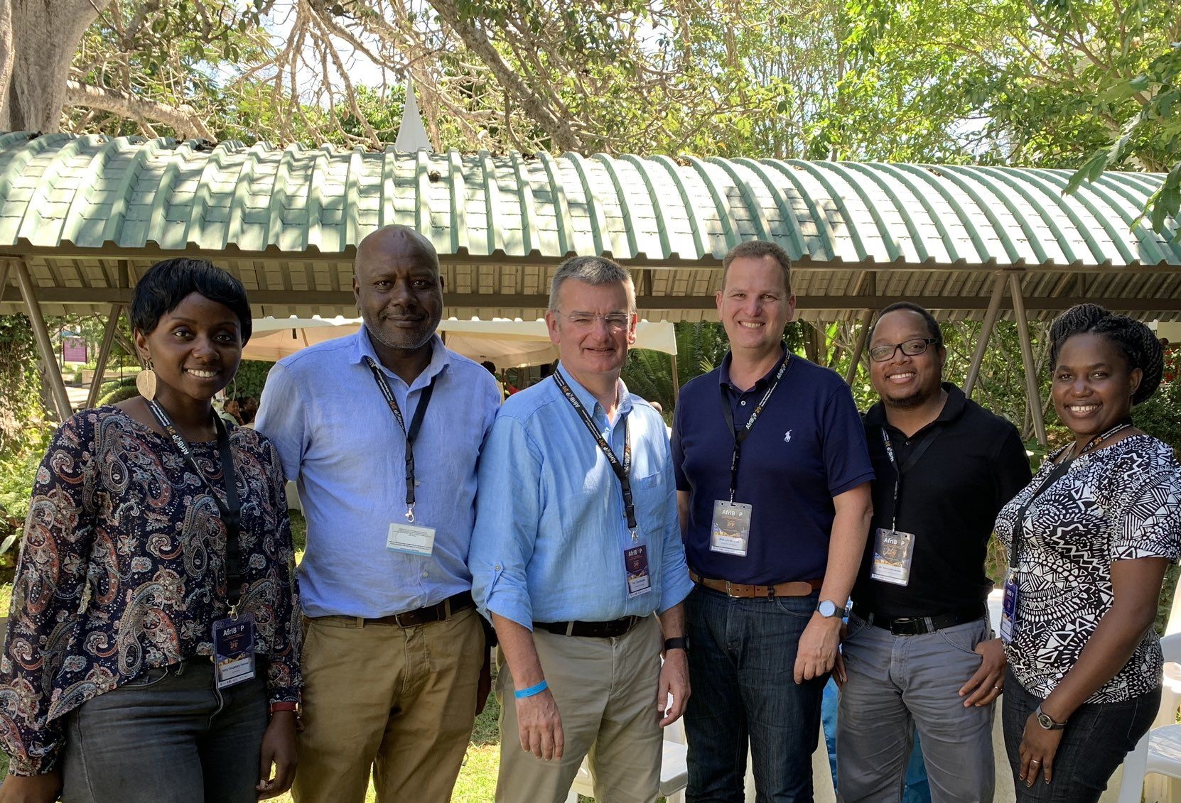The Institute's Prof iain McInnes and Prof Paul Garside stand with AfrIBOP attendees in Kalifi, Kenya