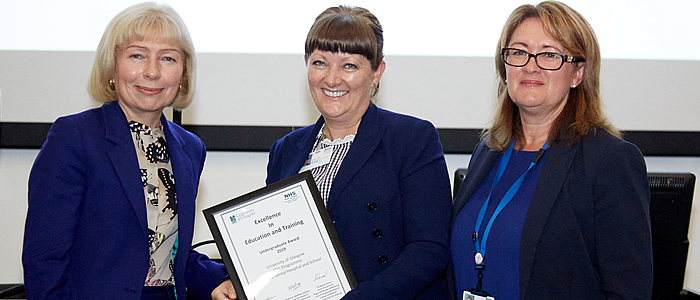 Dr Aileen Bell receiving certificate