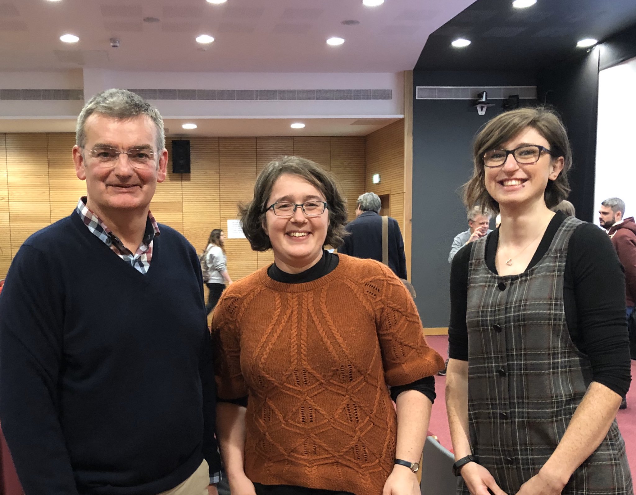 Paul Garside, Georgia Perona-Wright, Maddy Cunningham stand together for photograph at Immunology sessions