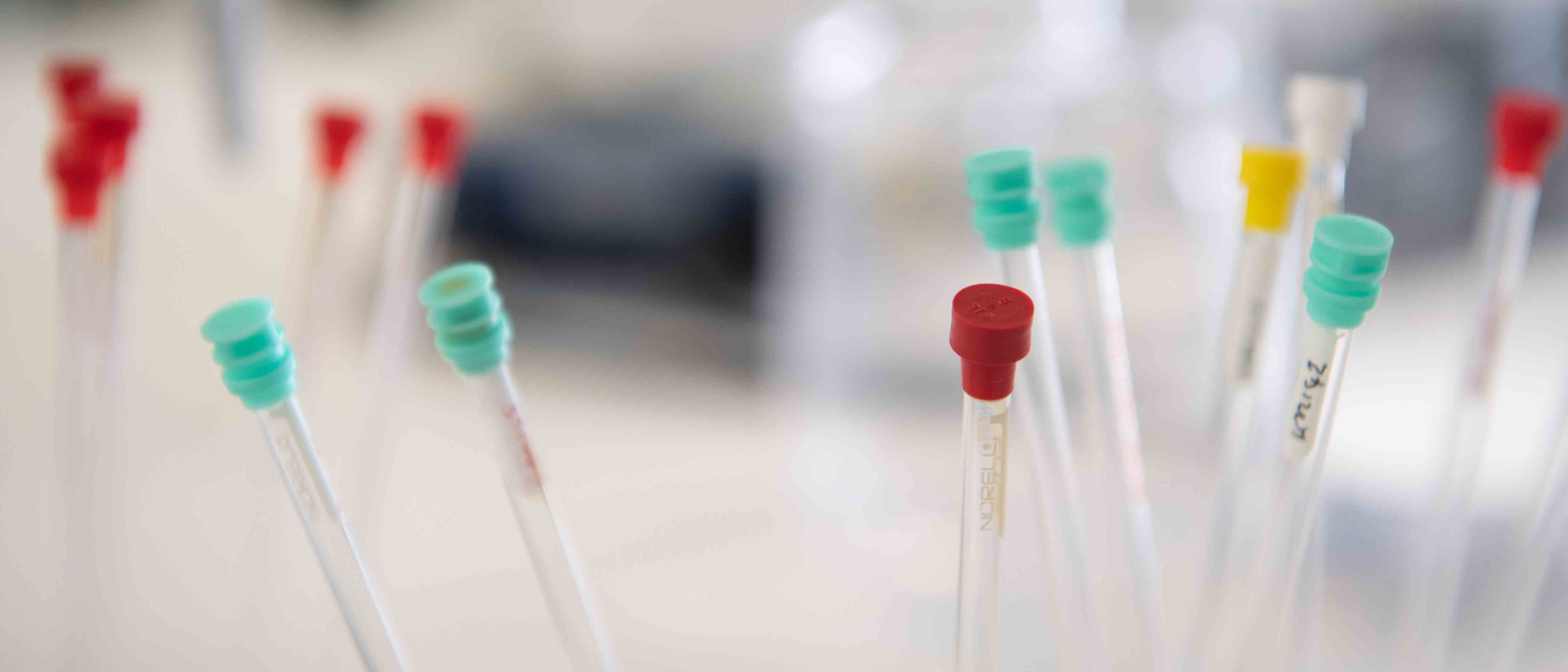 Photo of NMR tubes with colourful lids