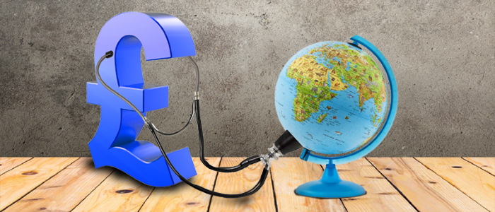 Am abstract image of a pound sign with a stethoscope listening to a globe on a desk