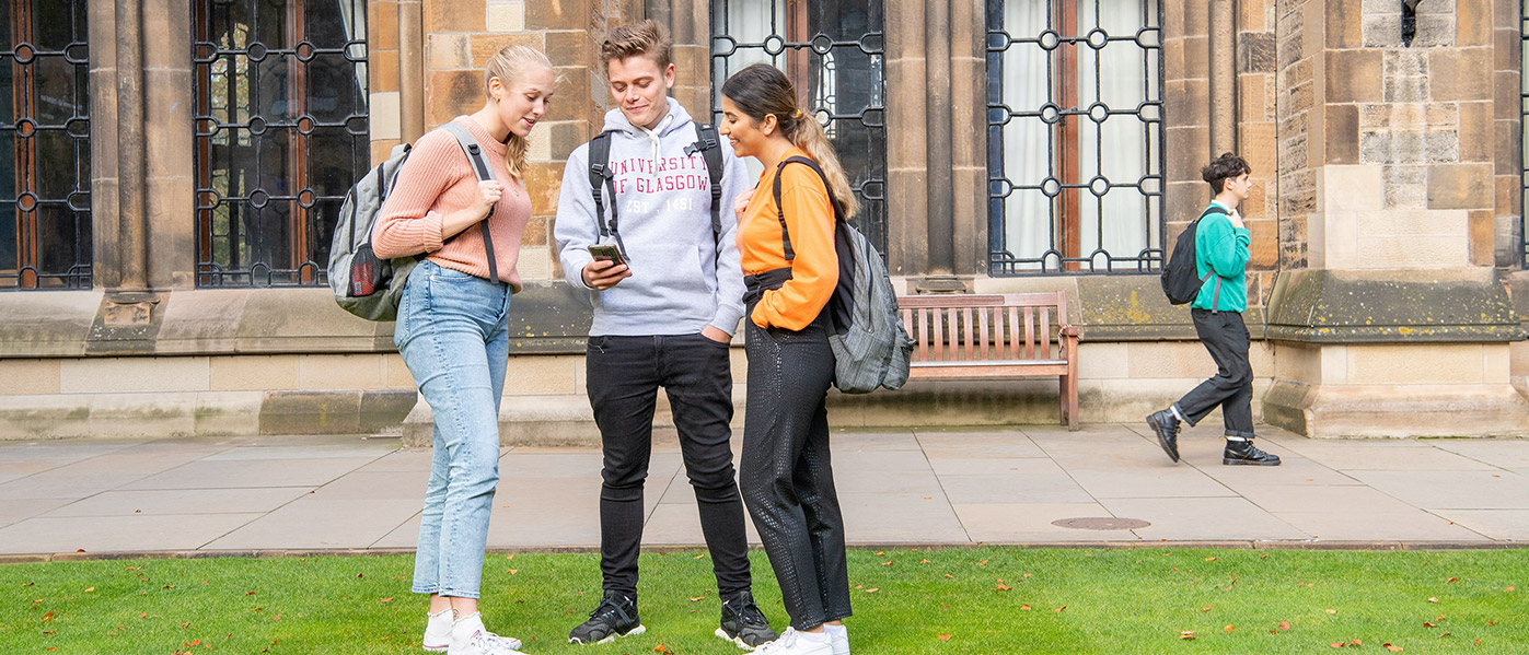 3 students on lawn