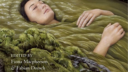 drawing of a white young woman with brown hair framing her face laying down with her eyes closed in a green ropey mass that emulates water, with rocks and moss in the foreground. In a corner, text 'edited by fiona macpherson and fabian dorsch'