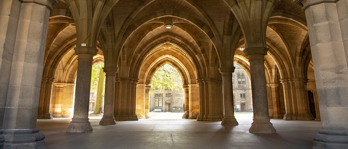 View through the Cloisters at University of Glasgow main building on a sunny day