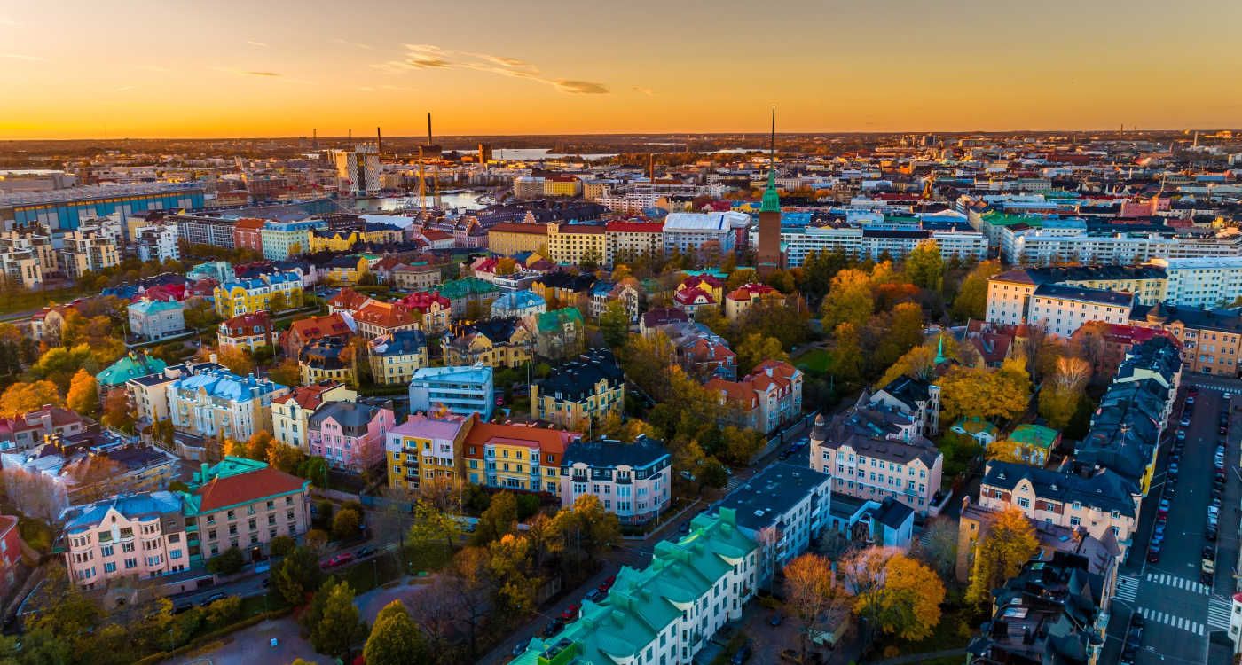 Aerial sunset view of city showing colourful buildings