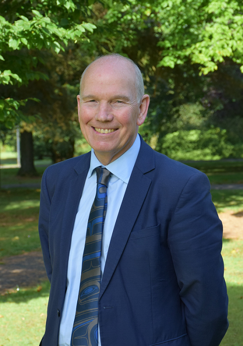 David Clark standing outside in the park