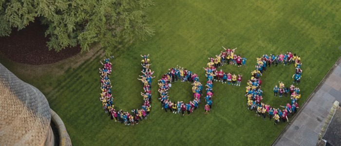 Aerial Image of people forming into the words UofG