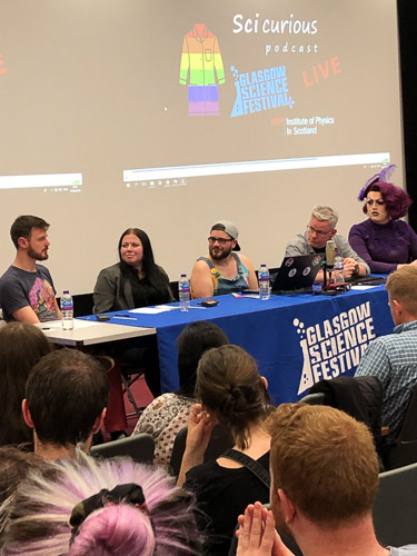 Photograph showing a panel of five people recording the sci-curious podcast. 