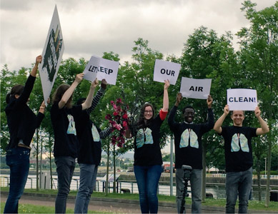 Photograph showing six protestors holding signs that say 'Keep Our Air Clean'.