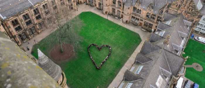 Aerial photo of the East Quadrangle, with students grouped in the shape of a heart. Photo by Greig Gallagher.