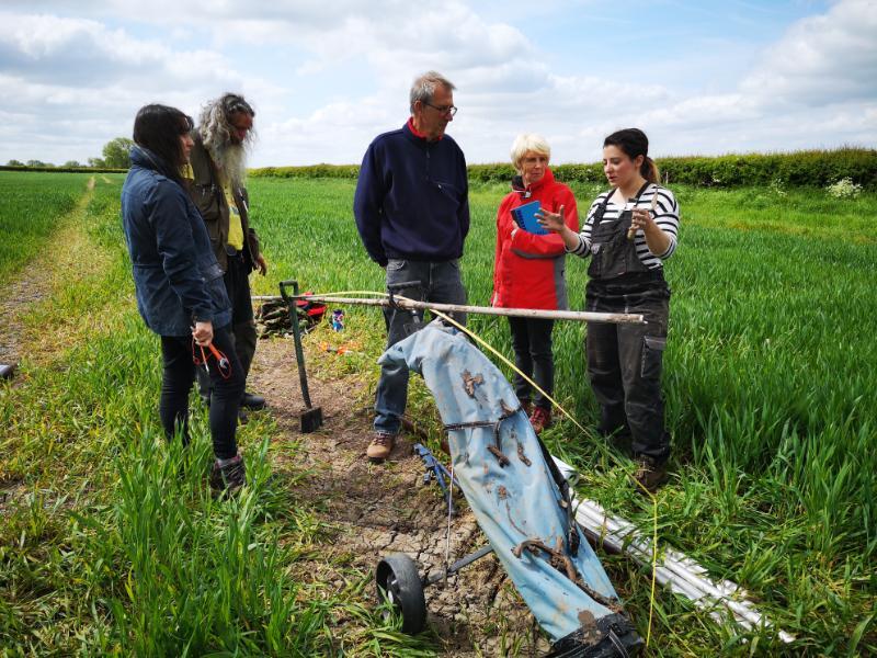 Fig 5: Dr Kim Davies explaining to volunteers how we interpret the landscape using archaeological approaches