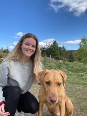 Image of Lisa Brotherstone from the netball club with golden dog