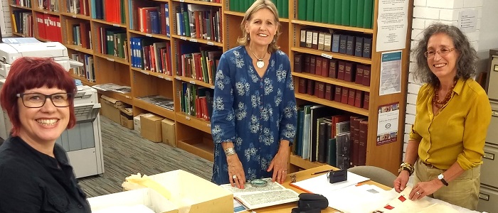Anita Quye (left), Jenny Balfour-Paul (middle) and Dominique Cardon (right) with the early 18th C. Crutchley Archive at SLHLA.