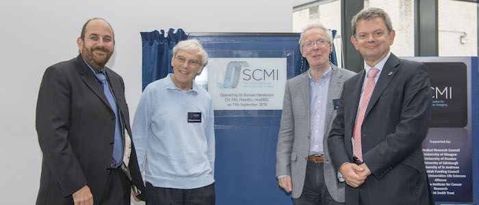Prof David Bhella, Dr Richard Henderson, Prof Richard Cogdell and Prof Sir Anton Muscatelli unveiling a plaque at the SCMI opening symposium