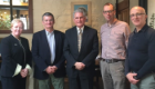 Alex Mackay (Administrator, WCIP), Prof Paul Garside, Sir Andrew Pocock, Prof James Brewer (Course Director, MSc Infection Biology), and Prof Andy Waters standing together for camera at Beit Scholarship meeting