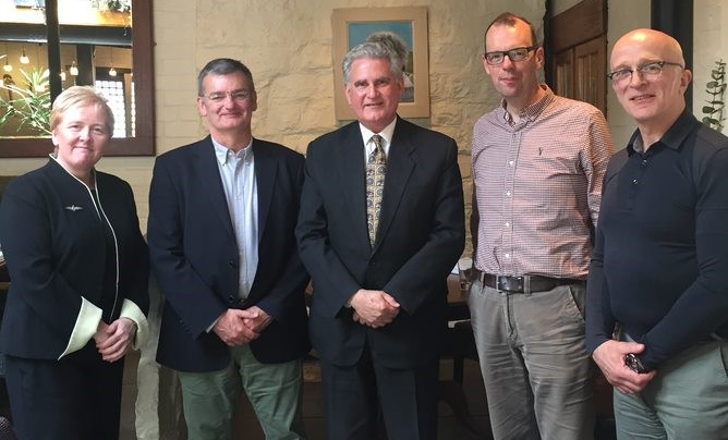 Alex Mackay (Administrator, WCIP), Prof Paul Garside, Sir Andrew Pocock, Prof James Brewer (Course Director, MSc Infection Biology), and Prof Andy Waters standing together for camera at Beit Scholarship meeting