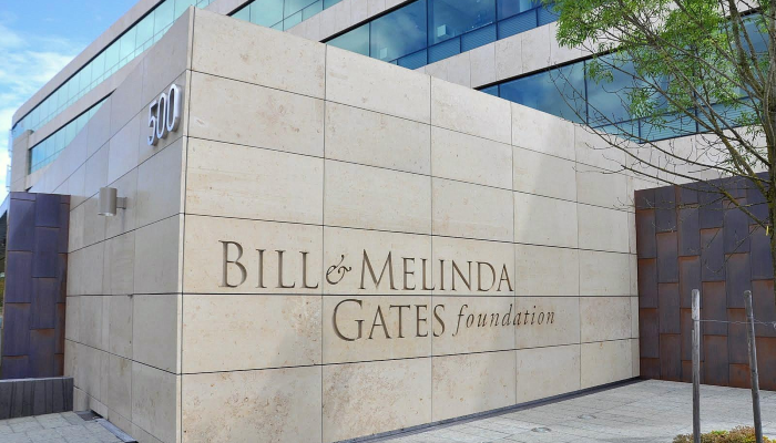 A brick wall with 'Bill and Melinda Gates Foundation' text outside the headquarters